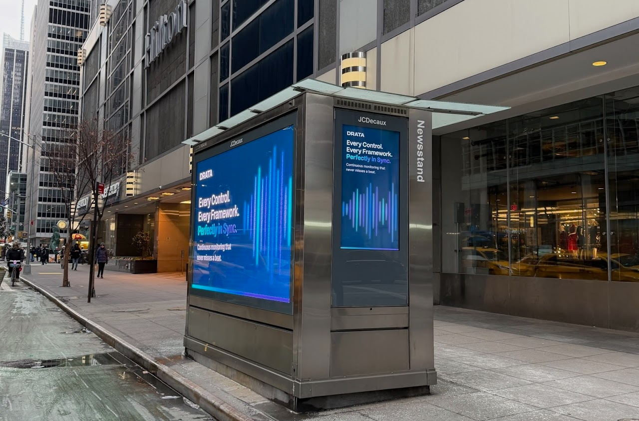 Drata two-sided newsstand outside the Hilton Midtown