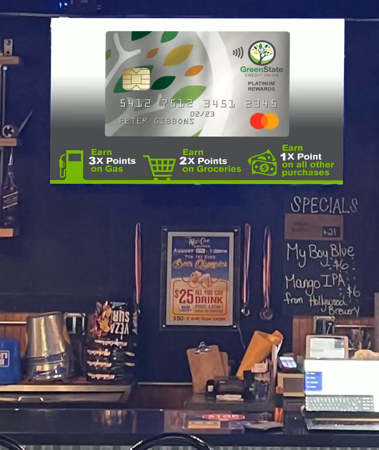 GreenState Credit Union rewards-card creative on a casual-dining screen.